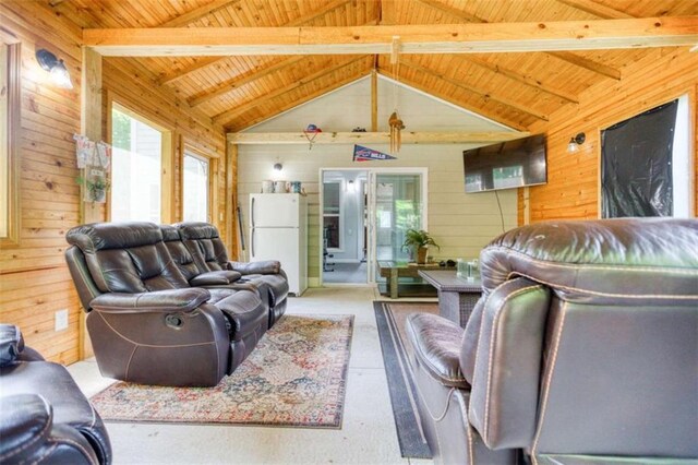 living area with wooden ceiling and wood walls