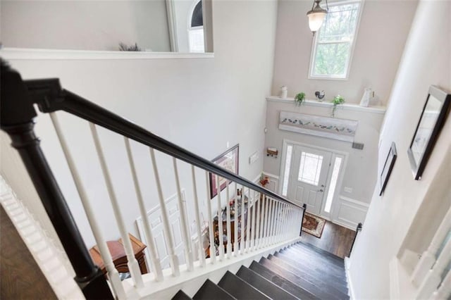 stairway featuring wood finished floors