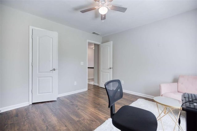 office featuring wood finished floors, ceiling fan, and baseboards
