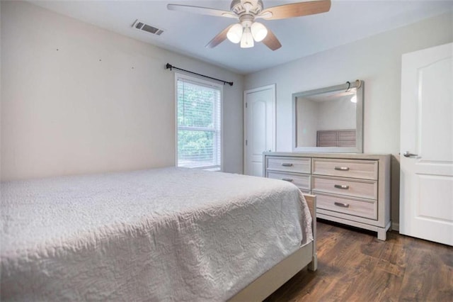 bedroom featuring dark wood-type flooring and ceiling fan