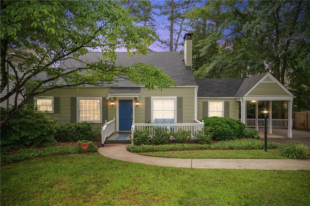 615 Sycamore Dr, Decatur, GA 30030 - view of front of property with a front yard, a chimney, and a porch