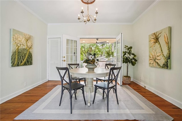 615 Sycamore Dr, Decatur, GA 30030 - dining area with baseboards, wood finished floors, crown molding, and a chandelier