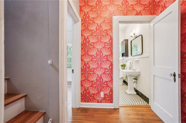 615 Sycamore Dr, Decatur, GA 30030 - bathroom with wallpapered walls, wood finished floors, and baseboards