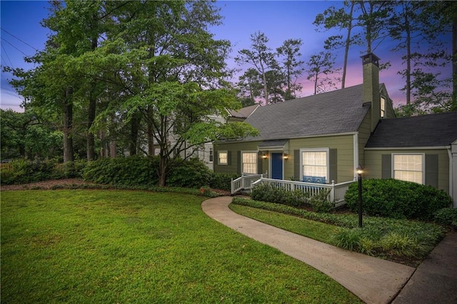 615 Sycamore Dr, Decatur, GA 30030 - view of front of house with a yard, a chimney, a porch, and roof with shingles