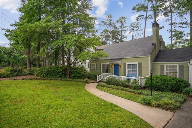 615 Sycamore Dr, Decatur, GA 30030 - view of front of home featuring a front lawn, a chimney, and roof with shingles