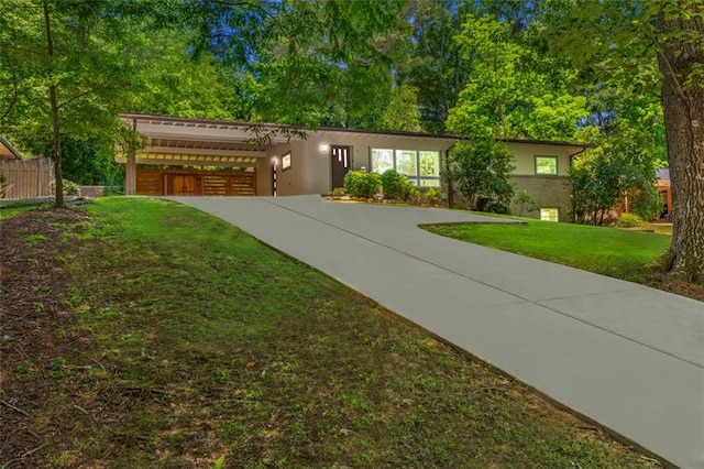 1492 Sagewood Cir, Stone Mountain, GA 30083 - view of front of home with a front yard and stucco siding
