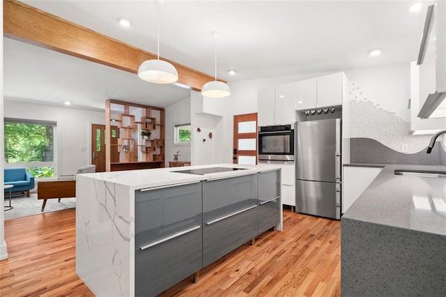 1492 Sagewood Cir, Stone Mountain, GA 30083 - kitchen with appliances with stainless steel finishes, modern cabinets, a sink, white cabinets, and gray cabinetry