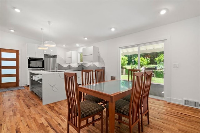 1492 Sagewood Cir, Stone Mountain, GA 30083 - dining space with light wood finished floors, baseboards, and recessed lighting