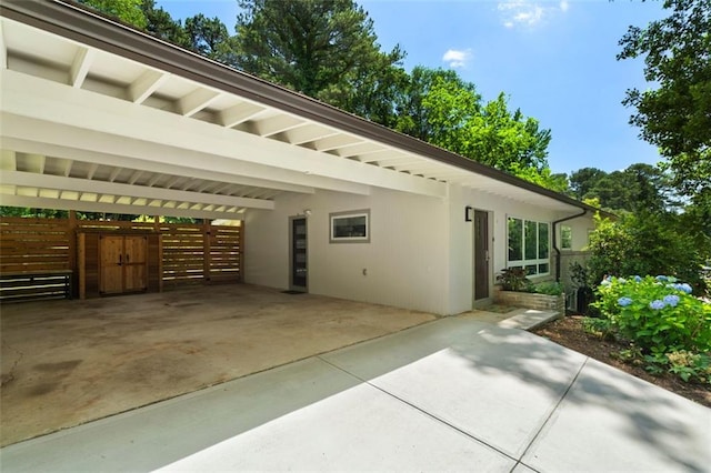 1492 Sagewood Cir, Stone Mountain, GA 30083 - view of side of home with driveway and a carport