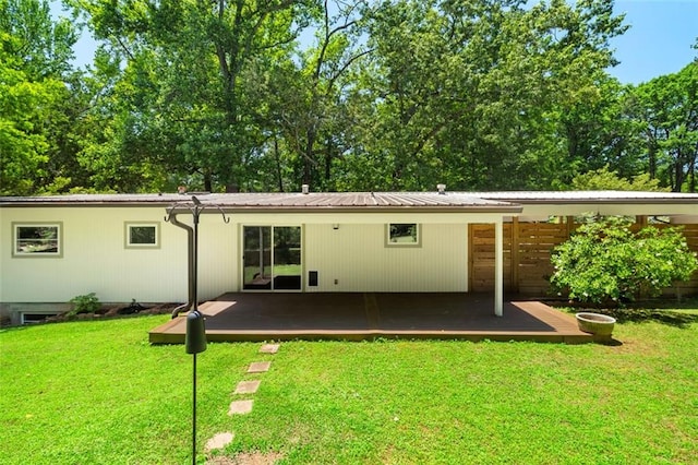 1492 Sagewood Cir, Stone Mountain, GA 30083 - back of house with a yard, metal roof, and a wooden deck