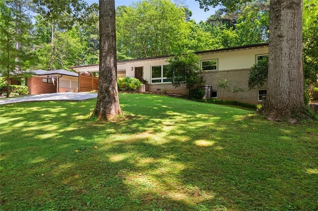 1492 Sagewood Cir, Stone Mountain, GA 30083 - single story home featuring concrete driveway, brick siding, and a front lawn