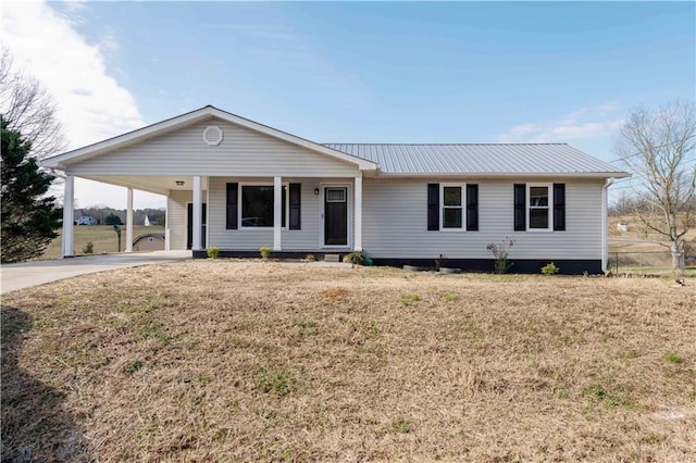 ranch-style house with a front yard and a carport