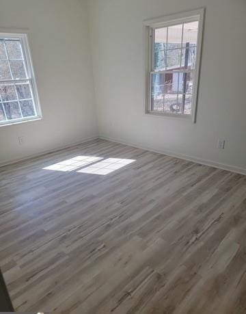 spare room featuring dark wood-type flooring