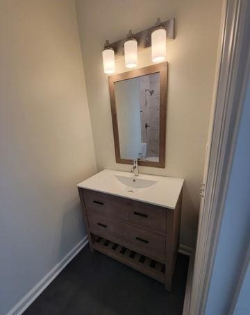 bathroom with vanity and baseboards