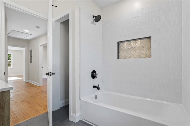 bathroom with vanity and tiled shower / bath