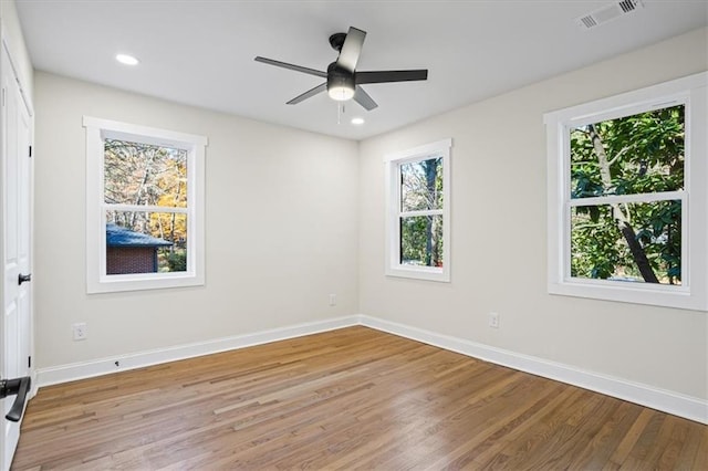 spare room with ceiling fan and light hardwood / wood-style floors