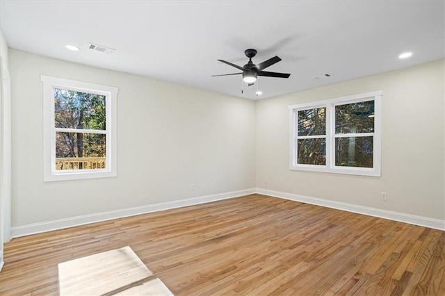 spare room featuring ceiling fan and light hardwood / wood-style flooring