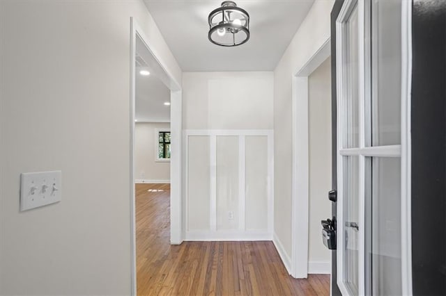 hall with light hardwood / wood-style floors