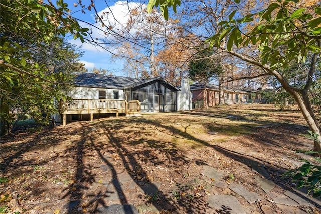 view of yard featuring a wooden deck