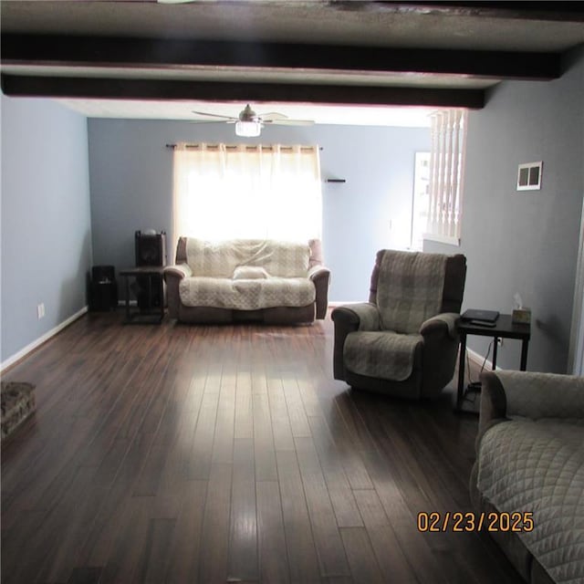 living room with visible vents, beamed ceiling, a ceiling fan, and dark wood-style flooring