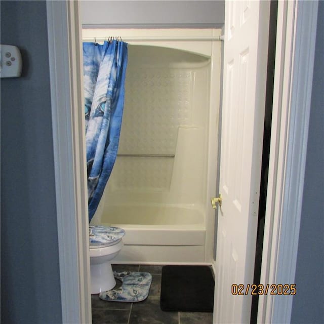 full bathroom with tile patterned floors, toilet, and shower / bath combo