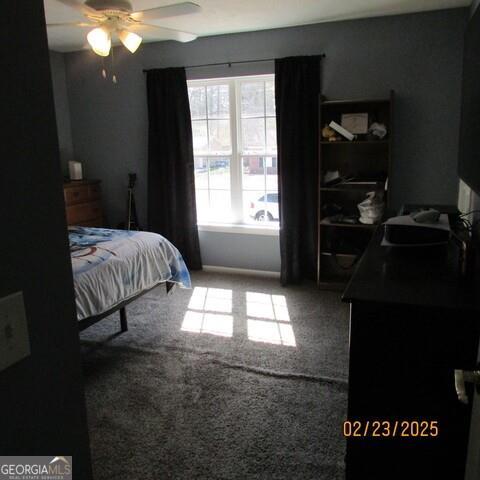 bedroom with ceiling fan and carpet flooring