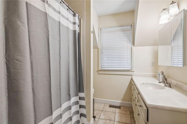 bathroom featuring baseboards, visible vents, tile patterned floors, curtained shower, and vanity