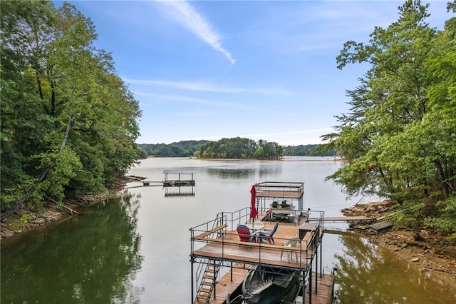 dock area with a water view and boat lift