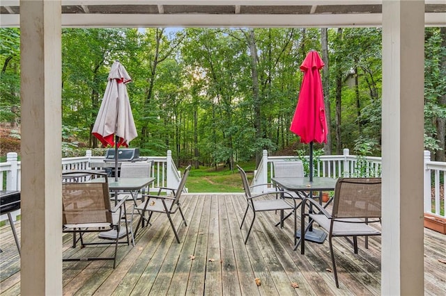 wooden deck featuring outdoor dining space