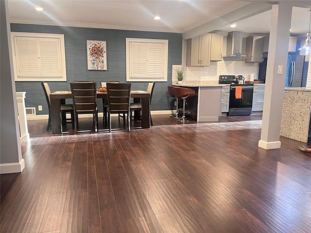 3629 Embry Cir, Atlanta, GA 30341 - kitchen featuring dark wood-type flooring, baseboards, wall chimney range hood, and range with electric stovetop