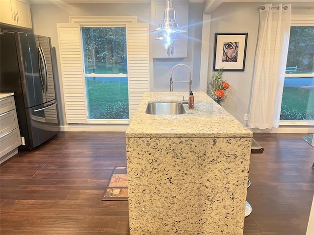 3629 Embry Cir, Atlanta, GA 30341 - kitchen with dark wood-type flooring, freestanding refrigerator, light stone counters, and a sink