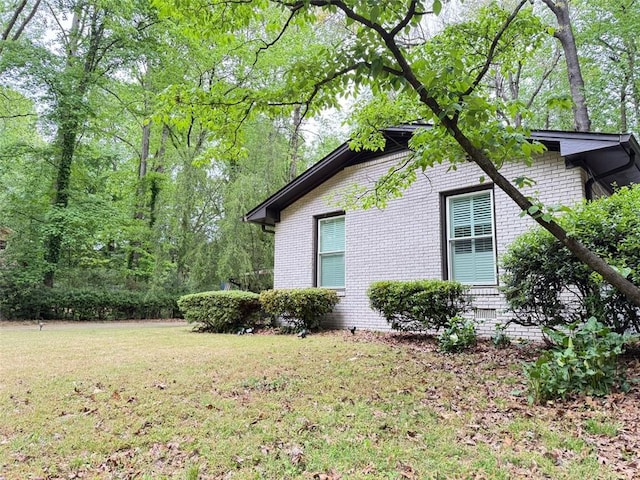 3629 Embry Cir, Atlanta, GA 30341 - view of side of home featuring a lawn and brick siding