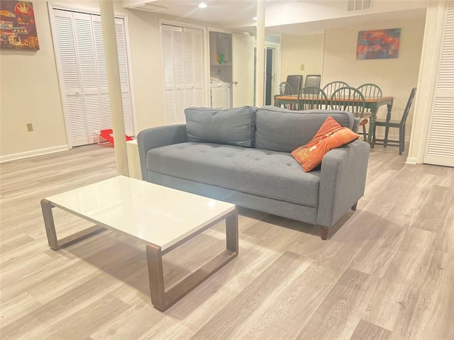 3629 Embry Cir, Atlanta, GA 30341 - living room featuring visible vents, light wood finished floors, and baseboards