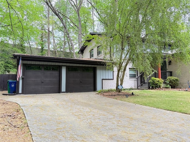 3629 Embry Cir, Atlanta, GA 30341 - view of front of property featuring a front lawn, brick siding, and driveway