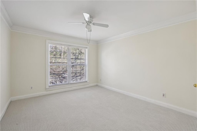 unfurnished room with ceiling fan, ornamental molding, and carpet flooring