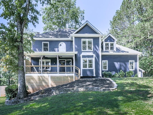rear view of property with a yard