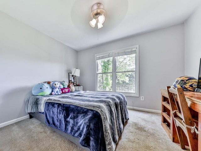 bedroom featuring baseboards, carpet, and a ceiling fan