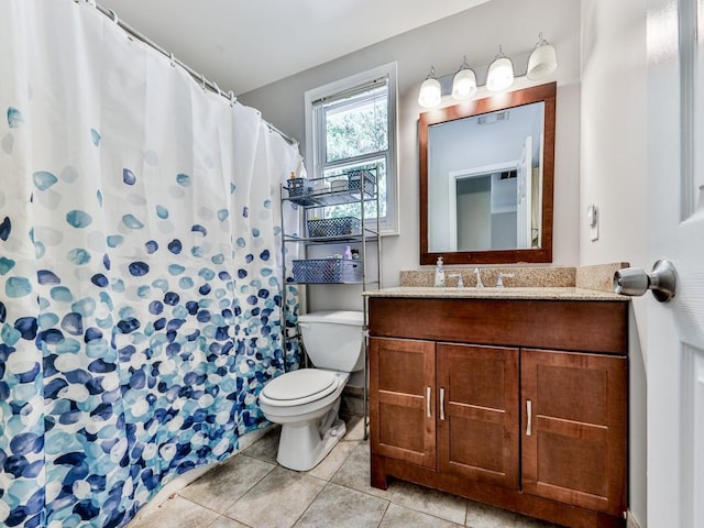 bathroom with toilet, tile patterned flooring, vanity, and a shower with shower curtain