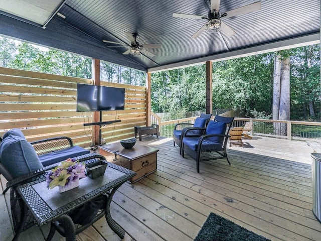 wooden deck featuring a ceiling fan and an outdoor hangout area