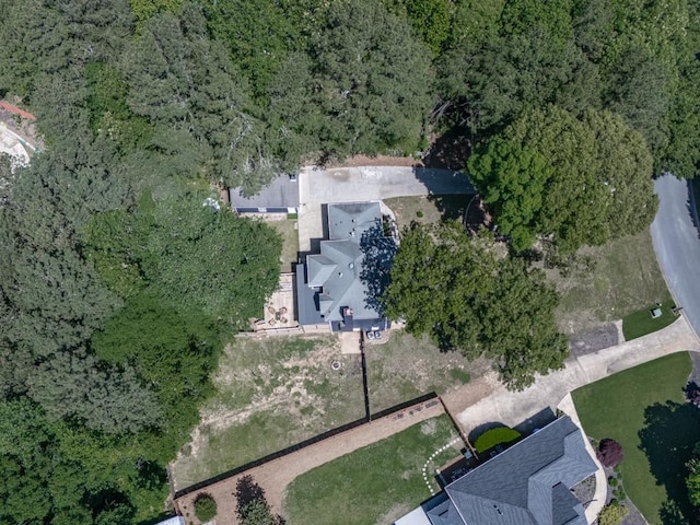 aerial overview of property's location featuring a heavily wooded area
