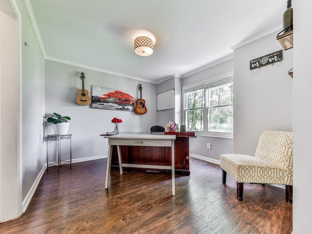 office space featuring wood finished floors, crown molding, and baseboards