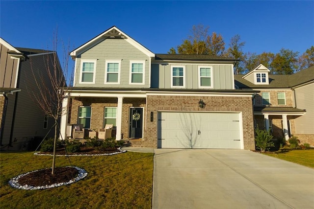 view of front of home with a garage and a front lawn