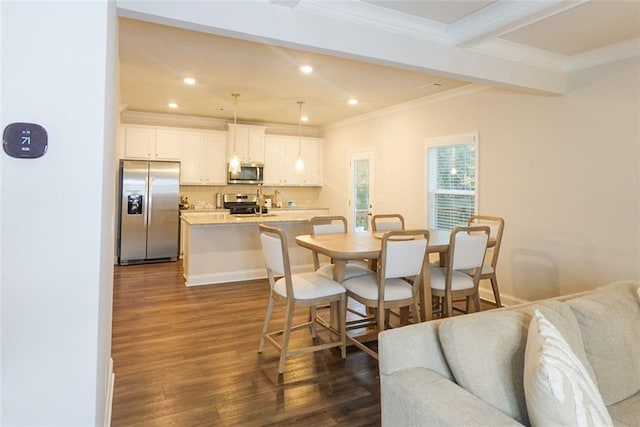 dining space with beam ceiling, crown molding, and dark wood-type flooring