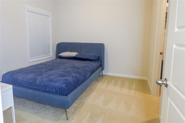 bedroom with light colored carpet