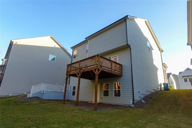 back of house with a yard and a wooden deck