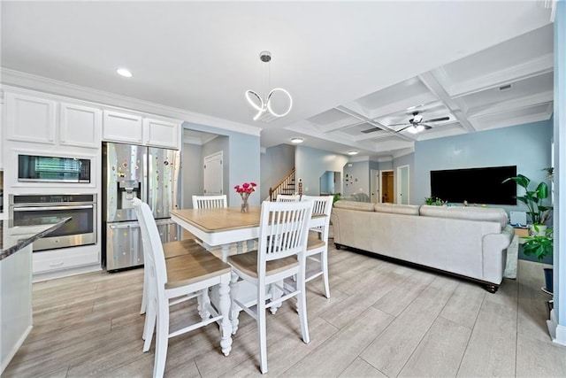 dining room featuring beamed ceiling, recessed lighting, ceiling fan with notable chandelier, light wood-style flooring, and coffered ceiling