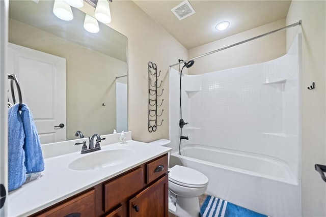 bathroom featuring vanity, visible vents, toilet, tile patterned floors, and shower / bathing tub combination