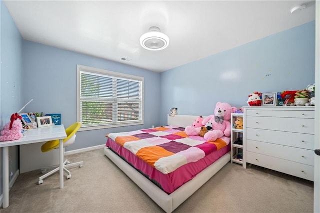 carpeted bedroom featuring baseboards and visible vents