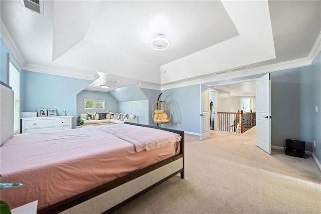 carpeted bedroom featuring a tray ceiling, crown molding, baseboards, and visible vents