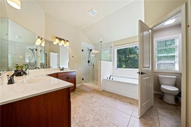 bathroom featuring visible vents, vanity, tile patterned floors, a stall shower, and a garden tub